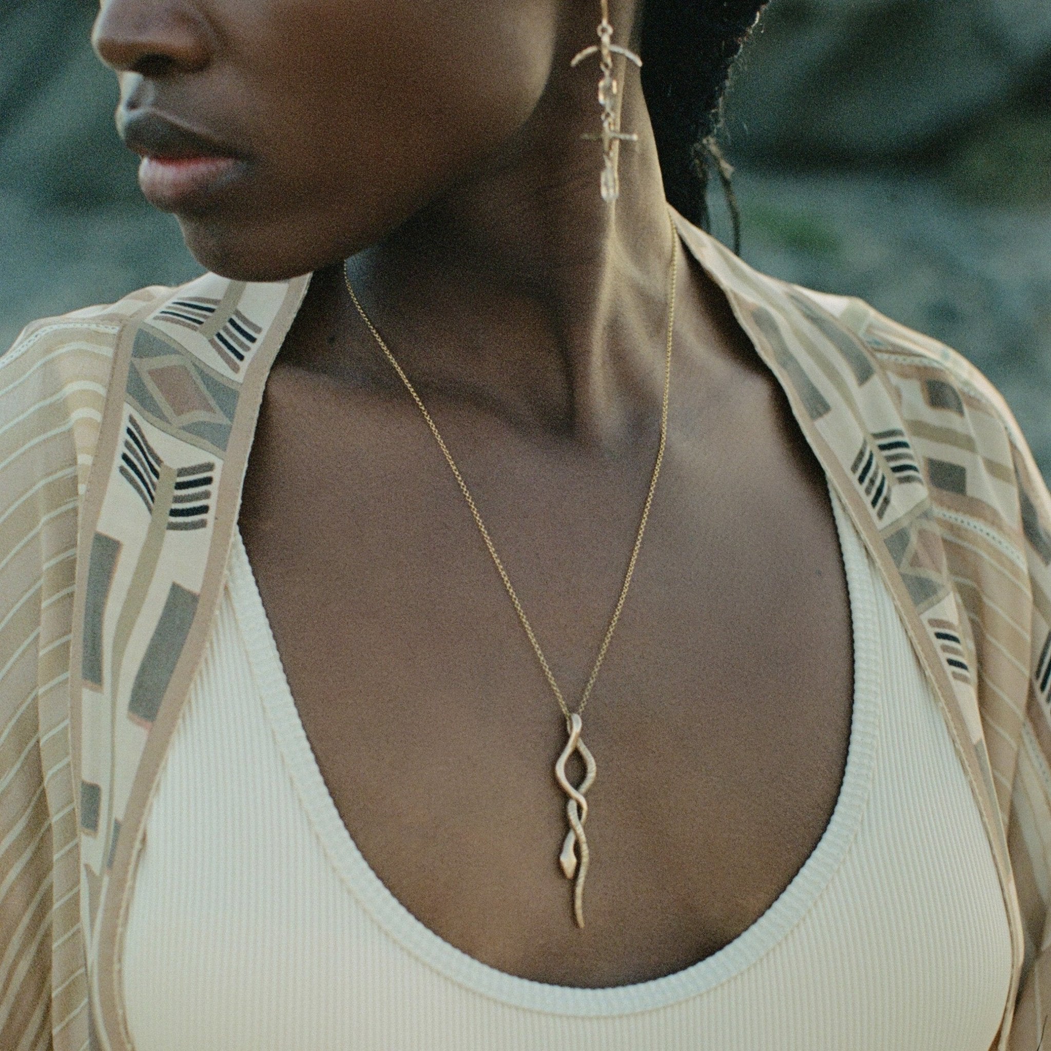 Gold on sale serpent necklace